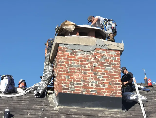 Ledyard Chimney Sweep installing a custom chimney crown in Ledyard, CT
