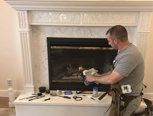Ledyard Chimney Sweep performing fireplace maintenance in Ledyard, CT