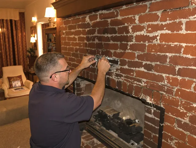 Ledyard Chimney Sweep expert fixing a fireplace in Ledyard, CT